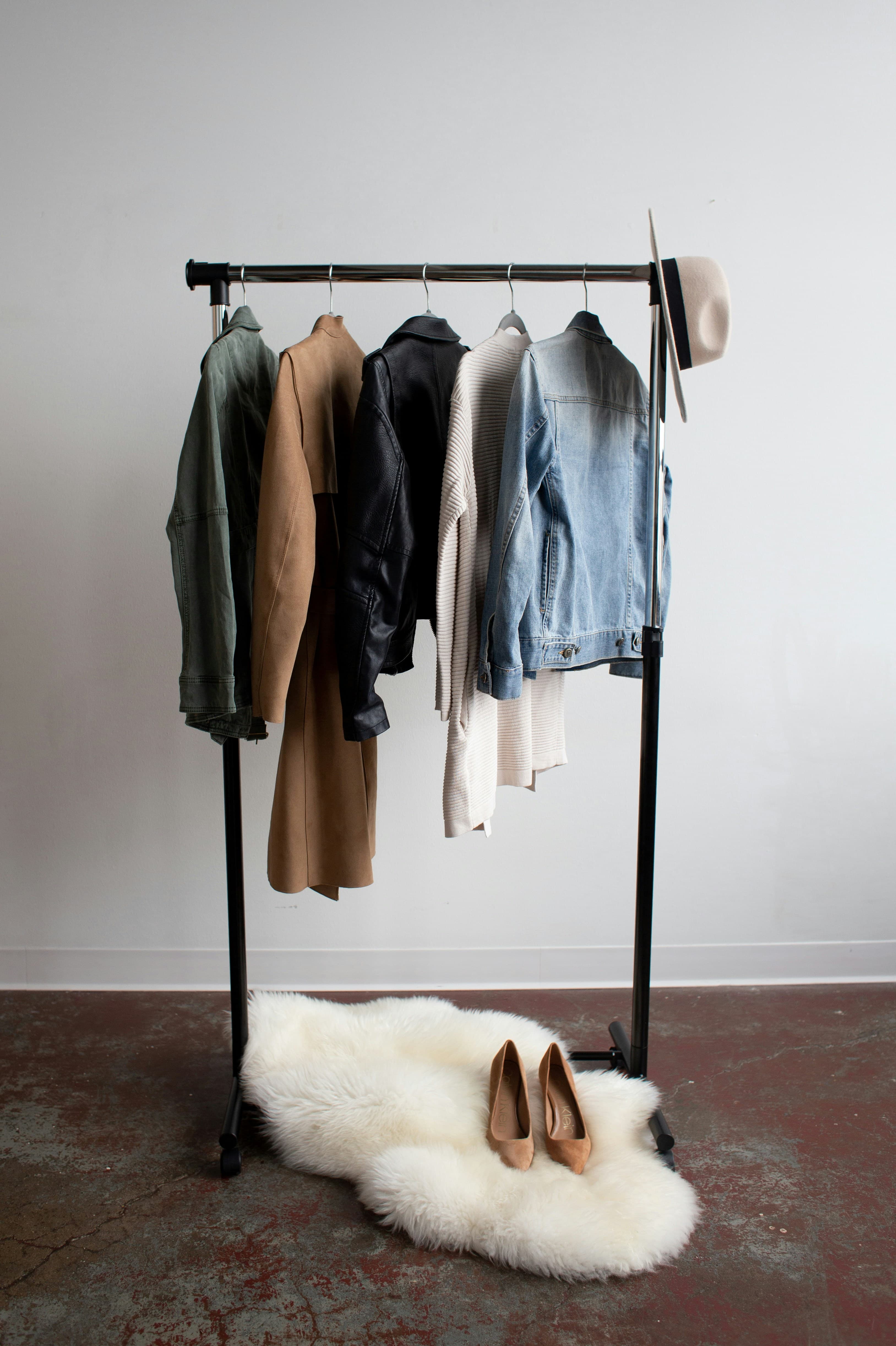 Clothing rack with jackets and a hat